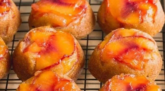 Peach Upside-Down Mini Cakes presented on a dessert platter