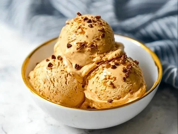 Creamy Peanut Butter Cottage Cheese Ice Cream in a bowl with a spoon