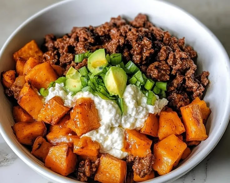 Protein-packed sweet potato beef bowls with vibrant vegetables and savory flavors