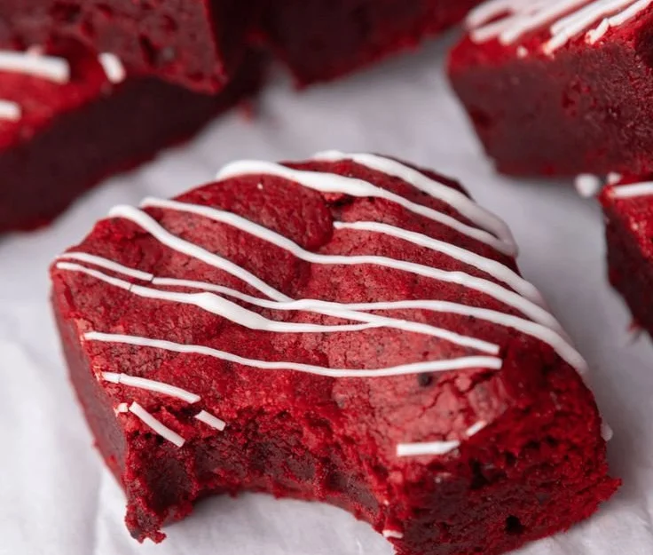 Delicious Red Velvet Brownies baked to perfection, topped with cream cheese frosting.