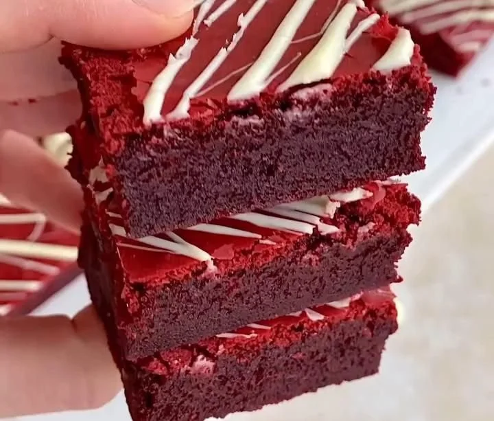 Delicious red velvet brownies topped with cream cheese frosting