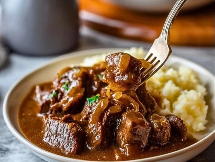 Slow cooker beef tips simmering in rich gravy for a hearty meal