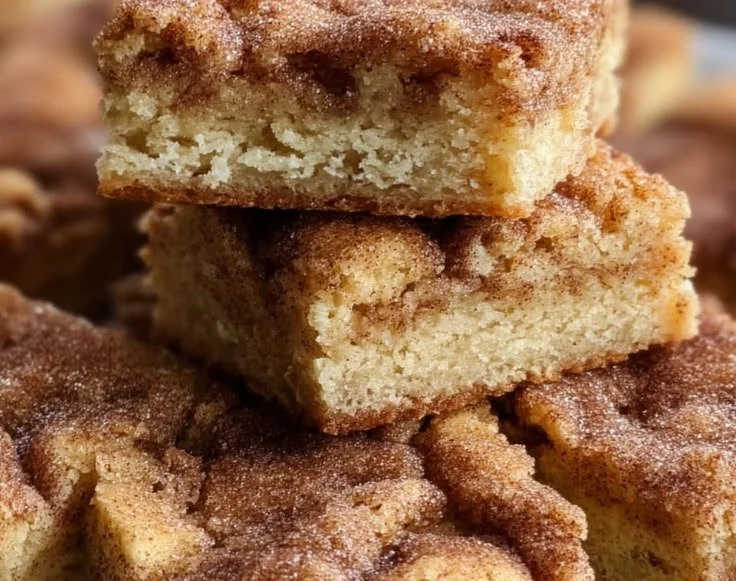 Delicious homemade snickerdoodle cookie bars on a plate