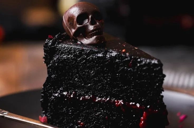 Spooky Black Velvet Halloween Cake with dark frosting and eerie decorations