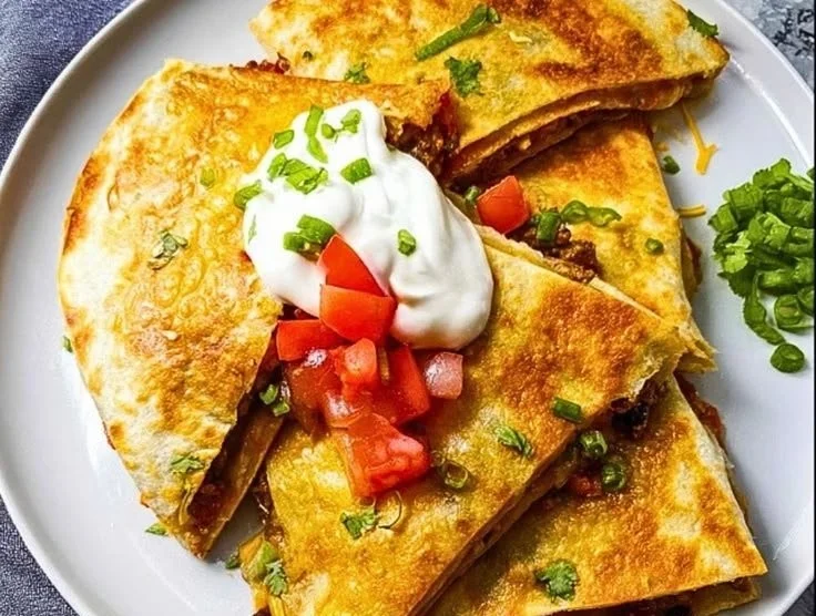 Sheet pan Tex-Mex quesadillas loaded with cheese and colorful vegetables.