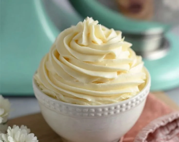 Delicious homemade vanilla buttercream frosting on a chocolate cupcake