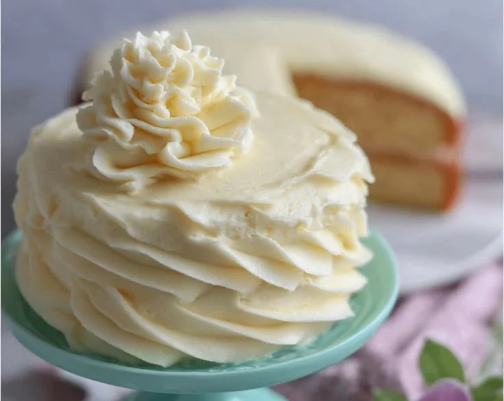 Delicious vanilla buttercream frosting in a bowl, ready for frosting cakes.
