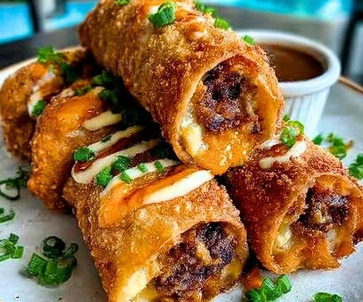 Delicious Voodoo Egg Rolls filled with spicy ingredients and served hot.