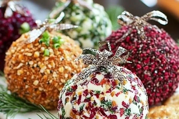 Delicious herb, nut, and spice-crusted cheese balls on a serving platter.